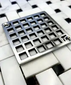 Square drain with Geometric squares 7 design in polished stainless steel finish.