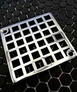 Square drain with Geometric squares 7 design in polished stainless steel finish.