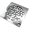Square drain with puzzle design in polished stainless steel finish.