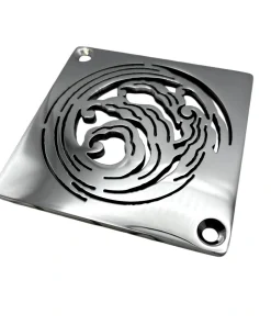 Square drain with wave design in polished stainless steel finish.