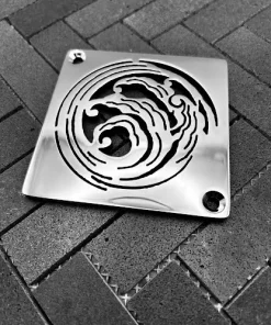 Square drain with polished stainless steel finish.