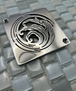 Square drain with polished stainless steel finish.