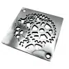 Square drain with sprockets design in polished stainless steel finish.