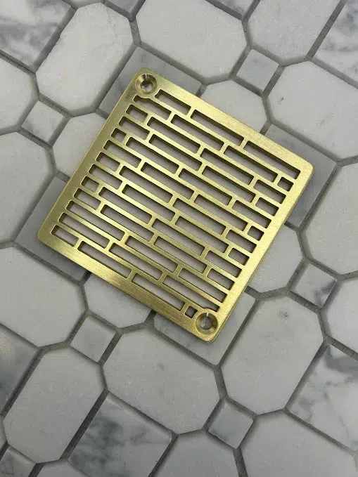 Square drain with unlaquered Brushed Brass Finish.