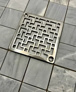 Square drain in tulun design with polished stainless steel finish.