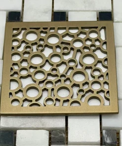 Bubbles square drain cover in Champagne Bronze by Designer Drains