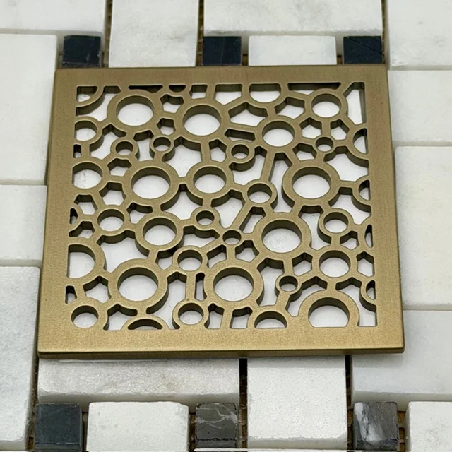 Bubbles square drain cover in Champagne Bronze by Designer Drains