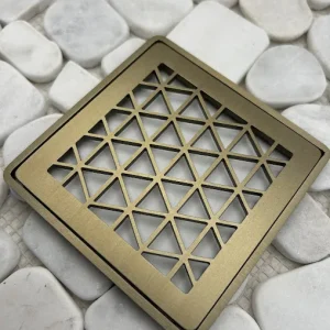 Square drain with champagne bronze finish.