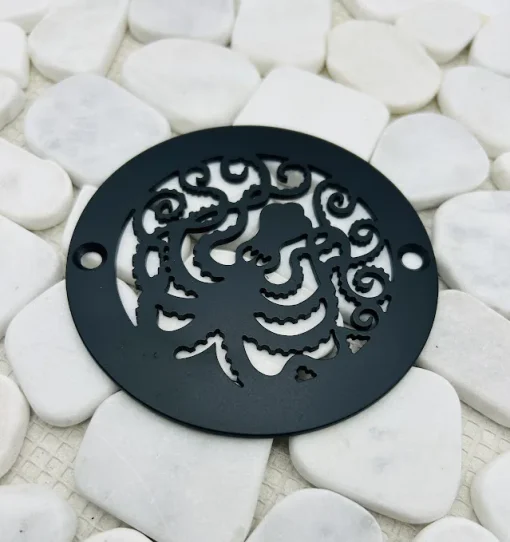 Round drain with a matte black finish.