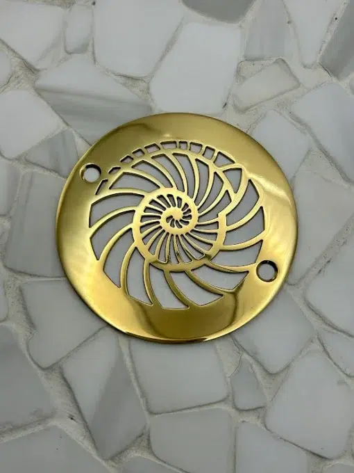 Round drain in a Polished Brass finish.