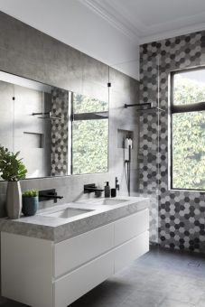 GIA renovations, an Australian firm specializing in renovations, has created a modern grey and white bathroom with black accents that proves you don’t always need a lot of color in an interior.