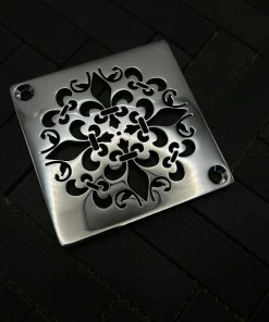 Square Mon Fleur drain with polished stainless steel finish.