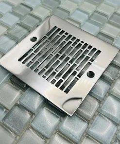 Square drain with polished stainless steel finish.