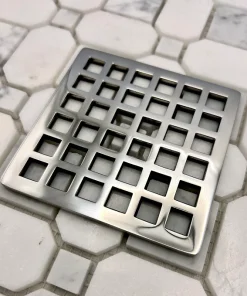 Square Geometric Squares Drain in Polished Stainless Steel Finish.