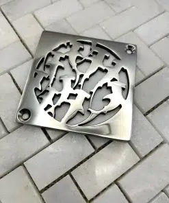 Square drain with sharks design in polished stainless steel finish.