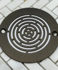 Geometric Maze oil rubbed bronze finish on white tile
