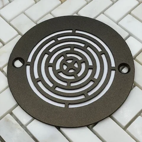 Geometric Maze oil rubbed bronze finish on white tile