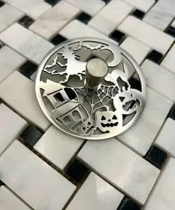 Round Sink Strainer with trick or treat design in polished stainless steel finish.