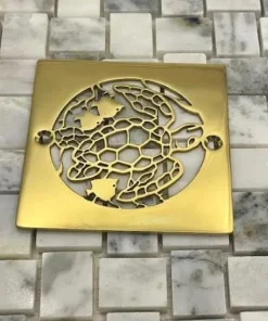 Turtle 4-inch square shower drain polished brass by Designer Drains