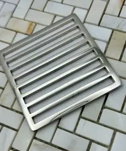 Square Schluter Trendline drain in polished nickel finish.