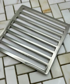 Square Schluter Trendline drain in polished nickel finish.