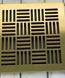 Geometric No. 6 square shower drain brushed brass on tile