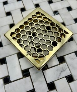 Schluter Trendline drain in Polished Brass finish.