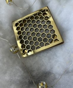 Schluter Trendline drain in Polished Brass finish.