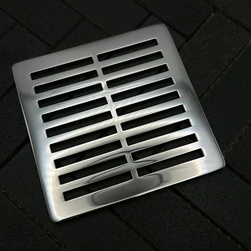 Square Parallels drain with polished stainless steel finish.