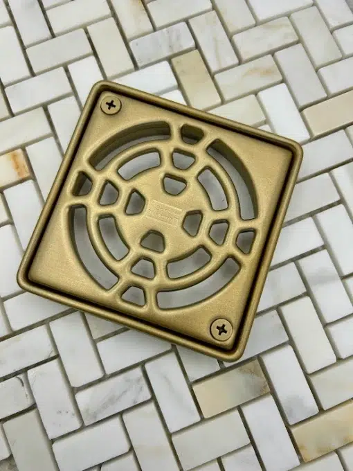 Schluter-Kerdi drain with Frame in champagne Bronze finish.