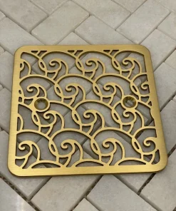 Waves Kohler Shower Drain brushed brass on tile