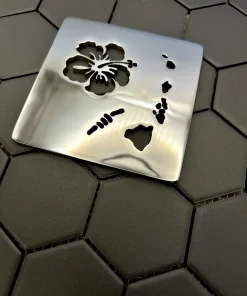 Square drain with Hawaii design in polished nickel finish. Compatible with Schluter Trendline.