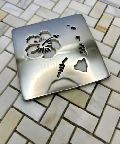 Square drain with Hawaii design in polished nickel finish. Compatible with Schluter Trendline.