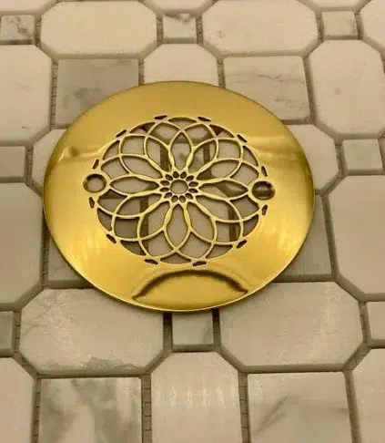Mandala 4.25 inch round shower drain polished brass