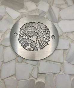 Seashells 4-inch round shower drain brushed stainless steel on tile