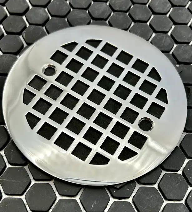 4.25 round geometric squares 7 in polished stainless steel finish on black tile