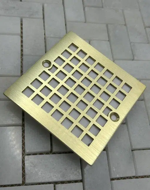 square drain with brass brushed finish.