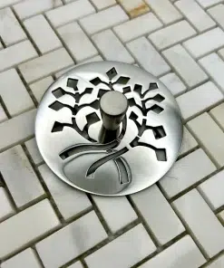 Nature Leaves sink stopper in polished stainless steel finish.