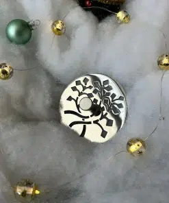 Nature Leaves sink stopper in polished stainless steel finish.