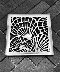 Square drain with polished stainless steel finish.