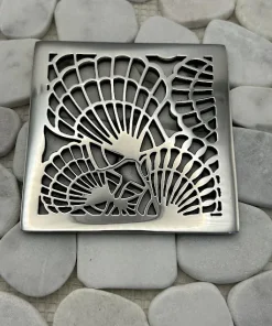 Square drain with polished stainless steel finish.