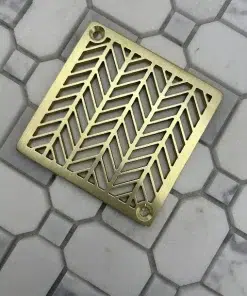 Square drain with unlaquered brushed brass finish.
