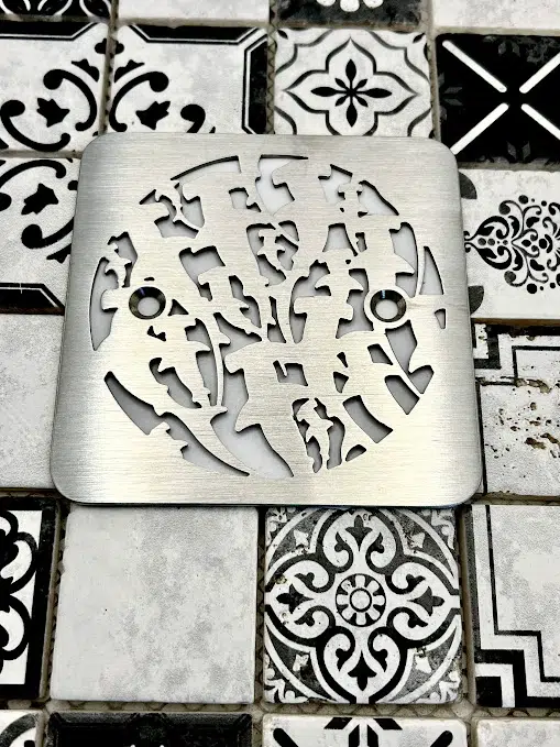 Square drain in Brushed stainless steel finish.