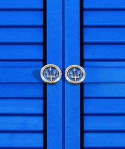 Trident-Knob-on-blue-cabinet2_Designer-Drains