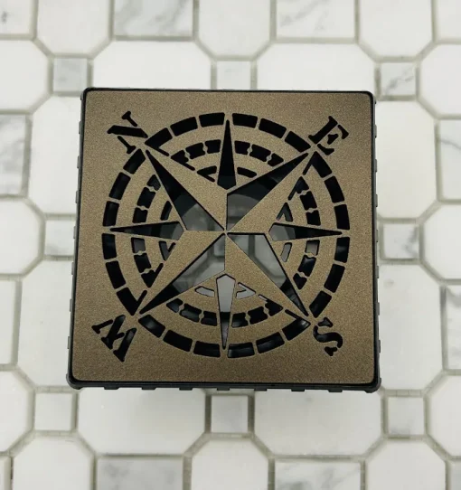 Square drain with drain body rough-in in oil rubbed bronze finish.