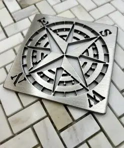 Square Drain with compass design in brushed stainless steel finish.
