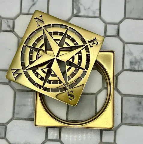 Designer Drains 4-inch Schluter-Kerdi Trendline-style drain cover with no fastening holes, brass finish