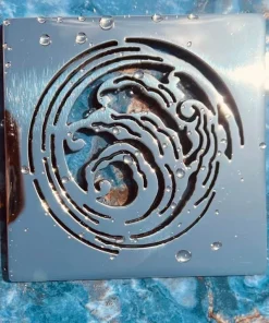 Nami square shower drain polished stainless steel on blue background