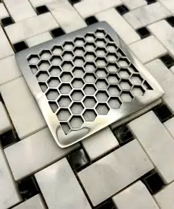 Square drain in honeycomb design with polished stainless steel finish.