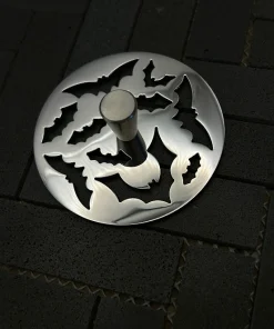 Round sink strainer in polished stainless steel finish.